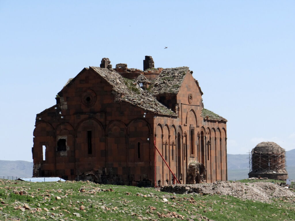 Panoramic view of Ani's ruins against mountain backdrop